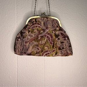 vintage tapestry kiss-lock purse with a metal frame and chain strap